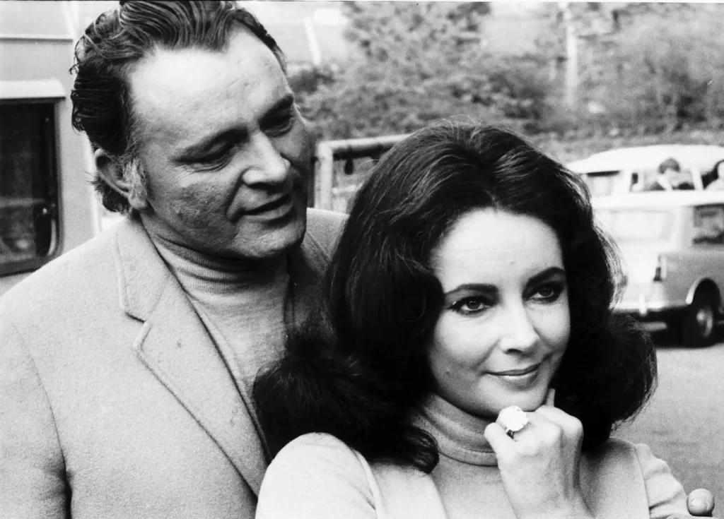 Elizabeth Taylor is pictured with her husband, Richard Burton, wearing the diamond ring he recently purchased for her, May 1968 (Trinity Mirror/Mirrorpix/Alamy)
